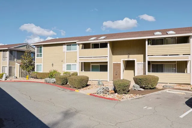 a view of a yard from a balcony
