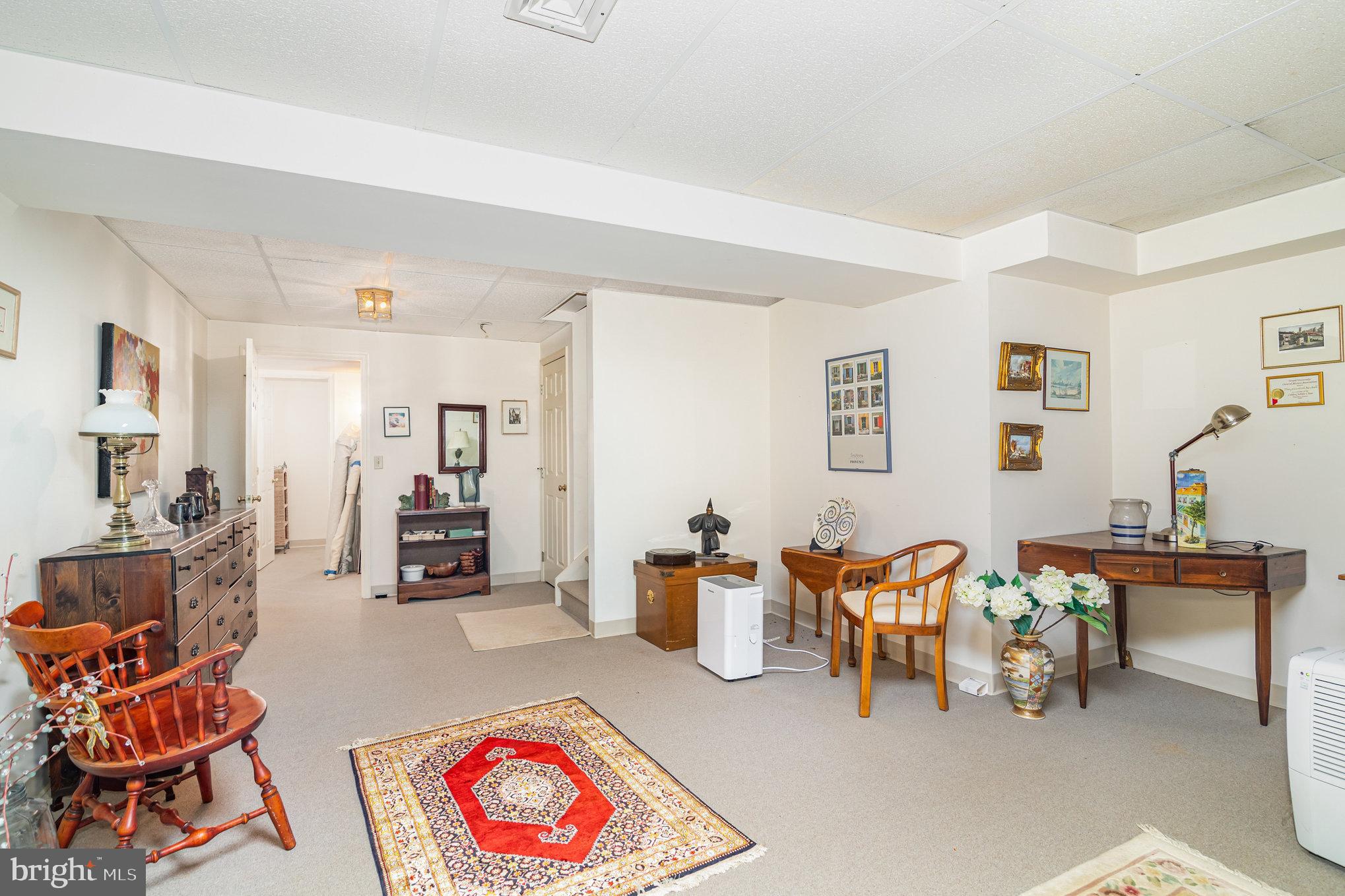 17 Leearden Road Hershey, PA 17033 - Photo 29 of 36 a living room with furniture kitchen view and a table