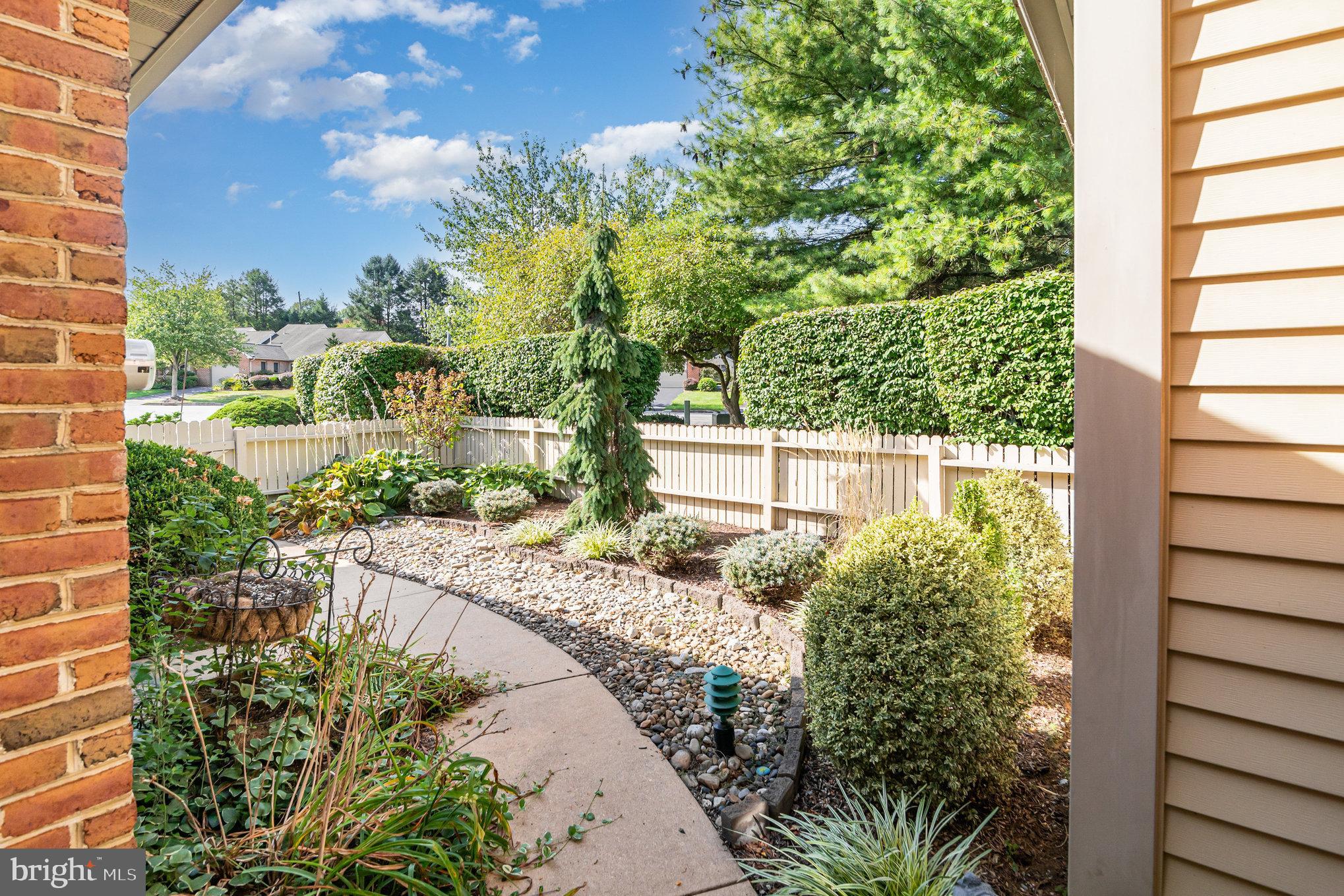 17 Leearden Road Hershey, PA 17033 - Photo 31 of 36 a view of a yard with plants and a large tree