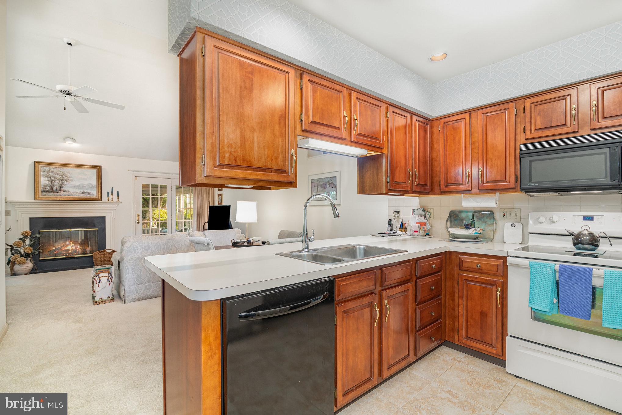 17 Leearden Road Hershey, PA 17033 - Photo 6 of 36 a kitchen with a sink stove top oven and cabinets