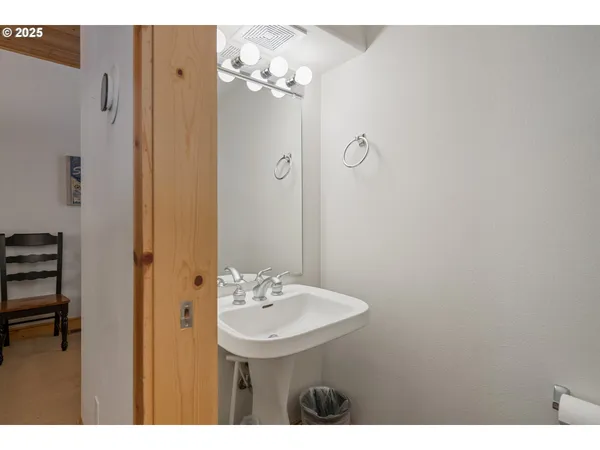 a bathroom with a sink a mirror and a shower