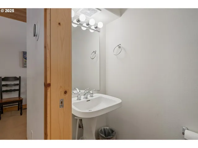 a bathroom with a sink a mirror and a shower