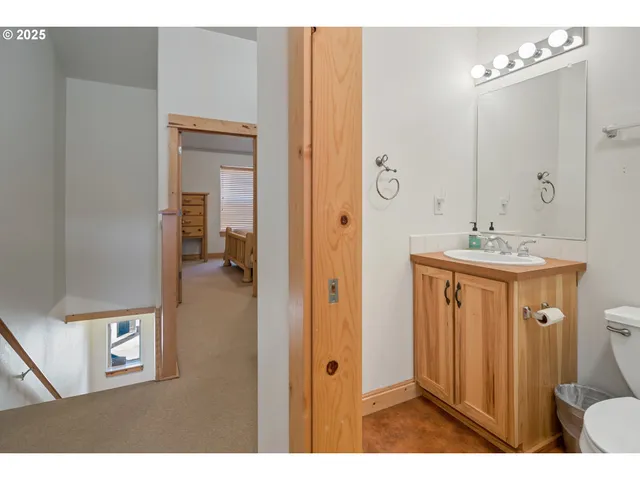 a bathroom with a sink a mirror and a shower