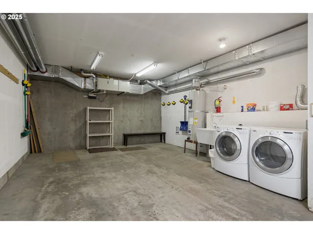 a view of a storage & utility room with washer and dryer