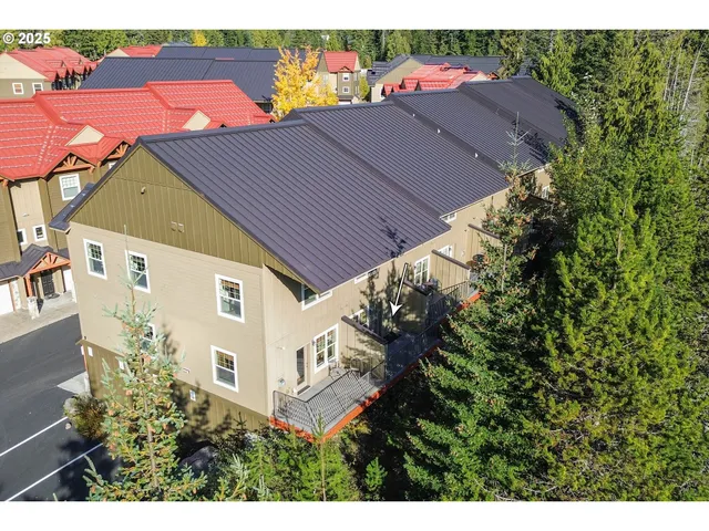 an aerial view of houses with yard