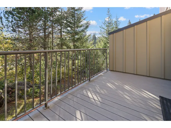 a view of balcony with wooden floor