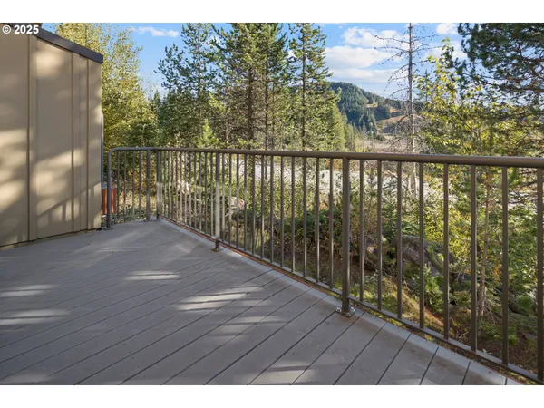 a view of balcony with wooden floor