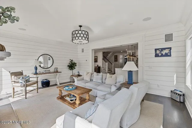 a living room with furniture a fireplace and a table