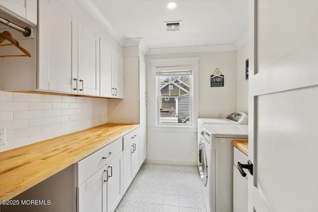 a kitchen with a refrigerator a stove a microwave and cabinets
