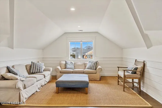 a living room with furniture and a rug