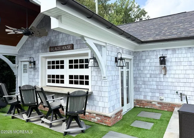 a view of a patio with table and chairs and potted plants