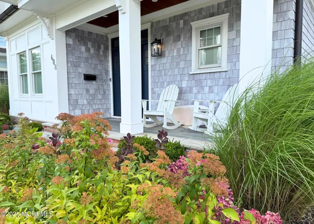 a flower plants in front of a house
