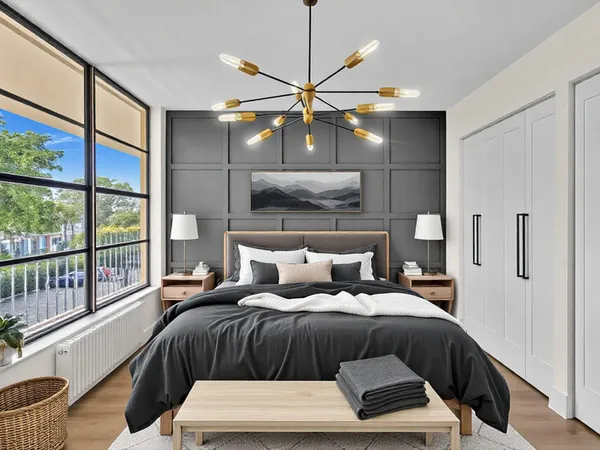 a bathroom with a sink a toilet a mirror and shower