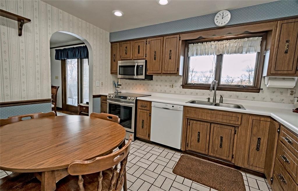 1050 Lagonda Road Washington, PA 15301 - Photo 11 of 25 a kitchen with sink a microwave and cabinets