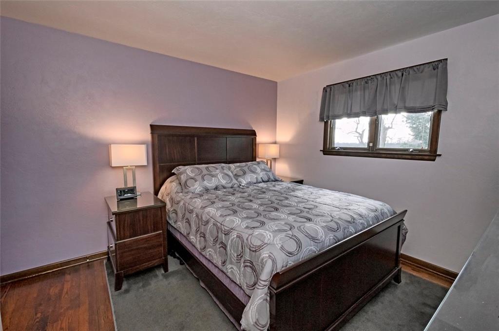 1050 Lagonda Road Washington, PA 15301 - Photo 14 of 25 a bed sitting in a bedroom next to a window