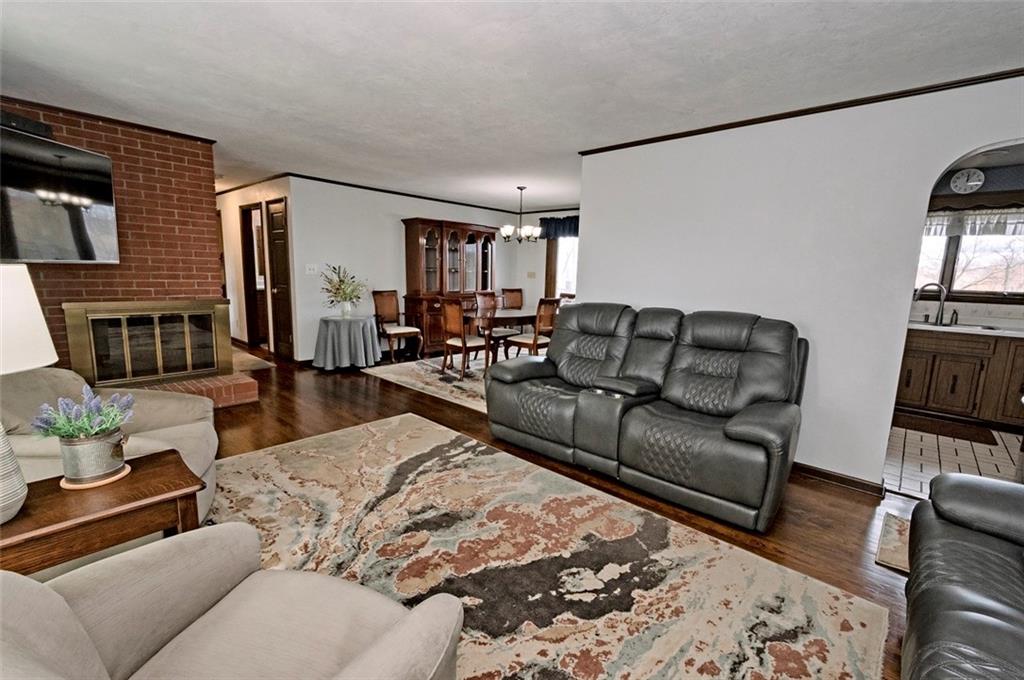1050 Lagonda Road Washington, PA 15301 - Photo 8 of 25 a living room with furniture wooden floor and a flat screen tv