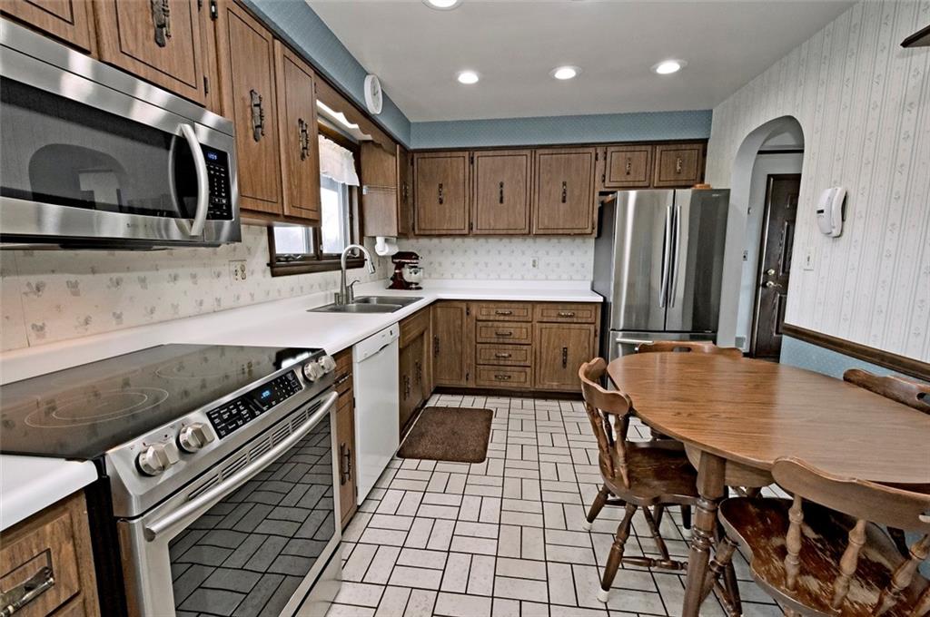 1050 Lagonda Road Washington, PA 15301 - Photo 10 of 25 a kitchen with stainless steel appliances granite countertop a stove a sink and a microwave