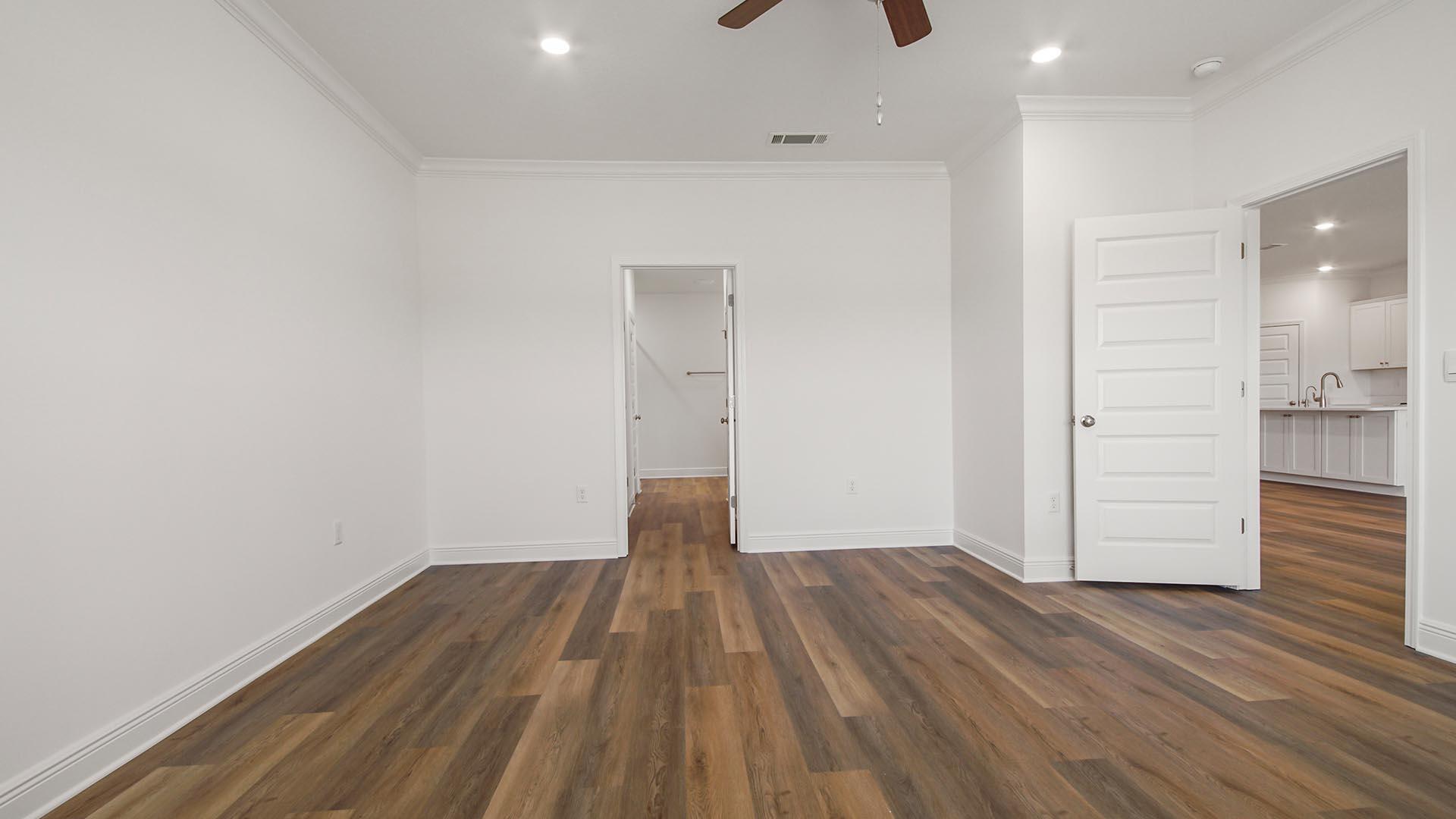 313 Holley Grv Lane Santa Rosa Beach, FL 32459 - Photo 16 of 34 wooden floor in an empty room with a window