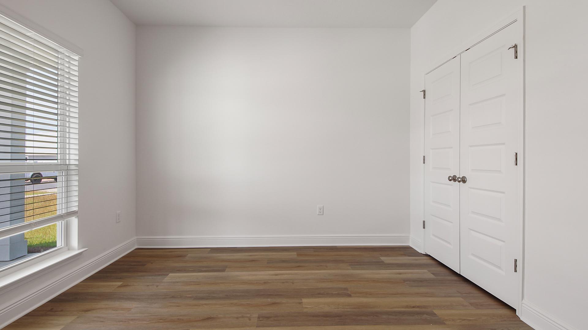 313 Holley Grv Lane Santa Rosa Beach, FL 32459 - Photo 26 of 34 a view of an empty room with a window and wooden floor