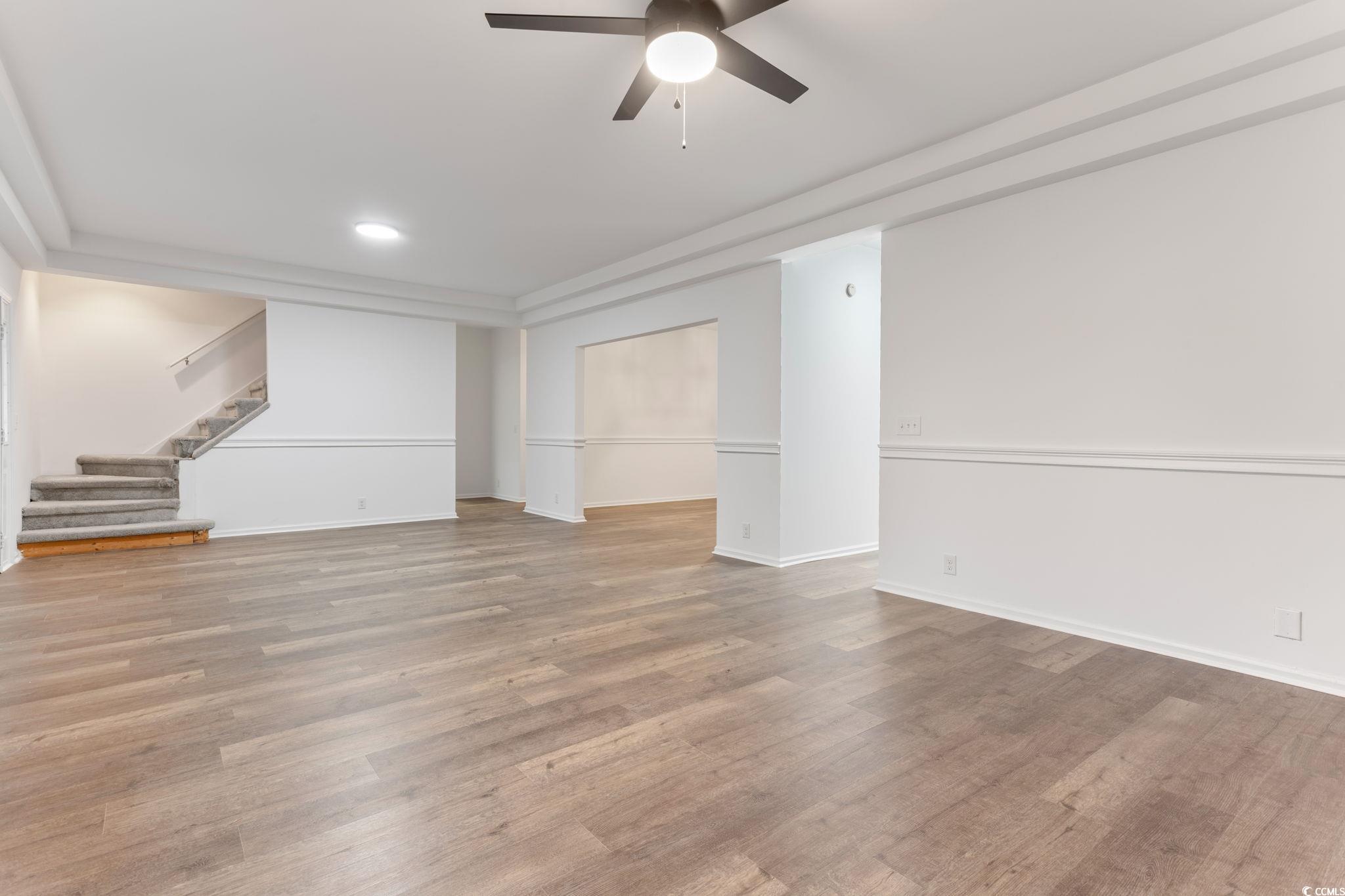 2321 Brick Drive Longs, SC 29568 - Photo 7 of 40 Unfurnished living room with light wood-style flooring, stairs, a ceiling fan, and recessed lighting