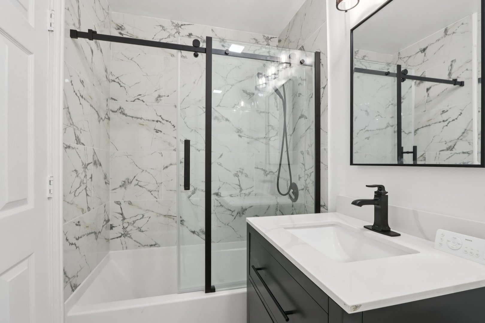 8916 Kenneth Drive, Unit 1E Des Plaines, IL 60016 - Photo 18 of 27 a bathroom with a sink and a bathtub
