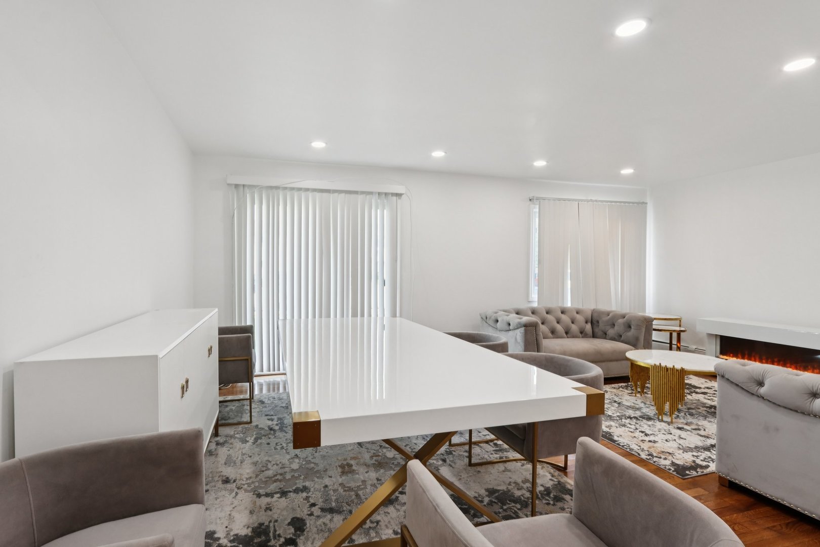 8916 Kenneth Drive, Unit 1E Des Plaines, IL 60016 - Photo 8 of 27 a living room with furniture and a large window