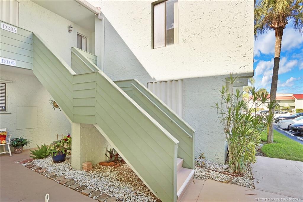 5443 Southeast Miles Grant Road, Unit D205 Stuart, FL 34997 - Photo 28 of 44 Stairway to Upper Level