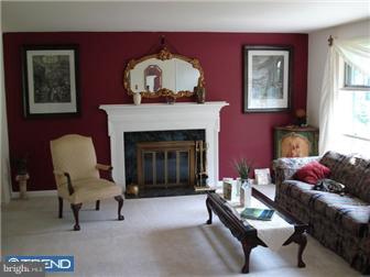 1435 Valley Forge Road Wayne, PA 19087 - Photo 2 of 11 a living room with furniture and a fireplace