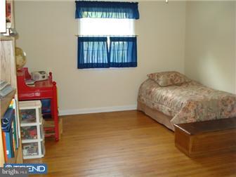 1435 Valley Forge Road Wayne, PA 19087 - Photo 5 of 11 a bedroom with a bed and a window