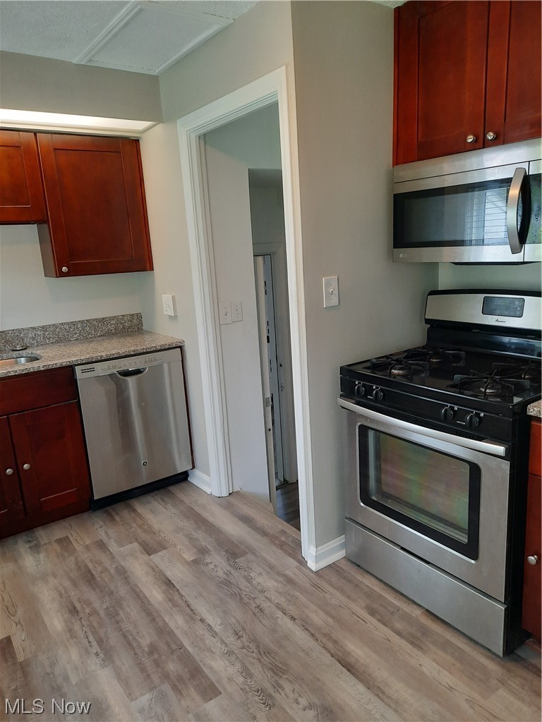 4518 Laurel Road Cleveland, OH 44121 - Photo 5 of 16 Stainless gas stove and oven and microwave