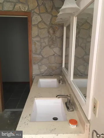 a bathroom with a sink and a shower