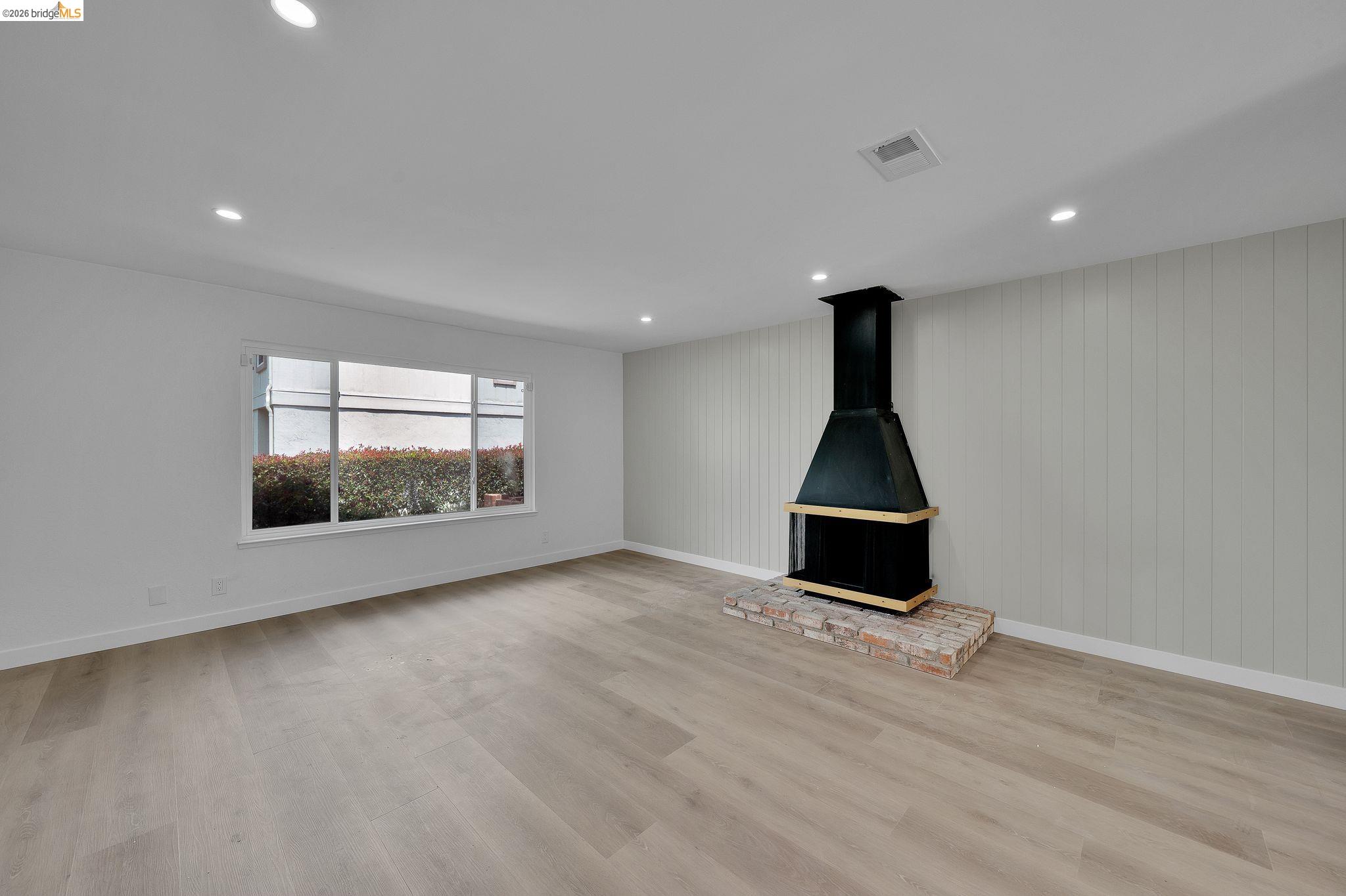 1808 Wildbrook Court, Unit D Concord, CA 94521 - Photo 10 of 47 wooden floor in an empty room with a window