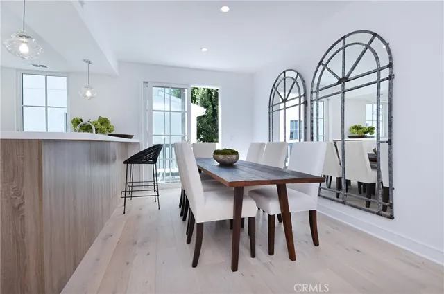 a view of a dining room with furniture and window