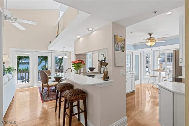 a view of a dining room with furniture wooden floor and chandelier