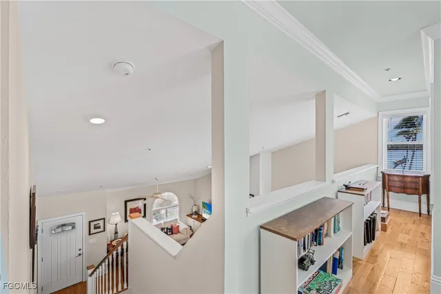 a living room with furniture and a book shelf