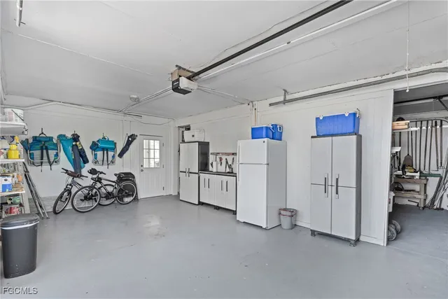 a view of a patio with table and chairs and potted plants