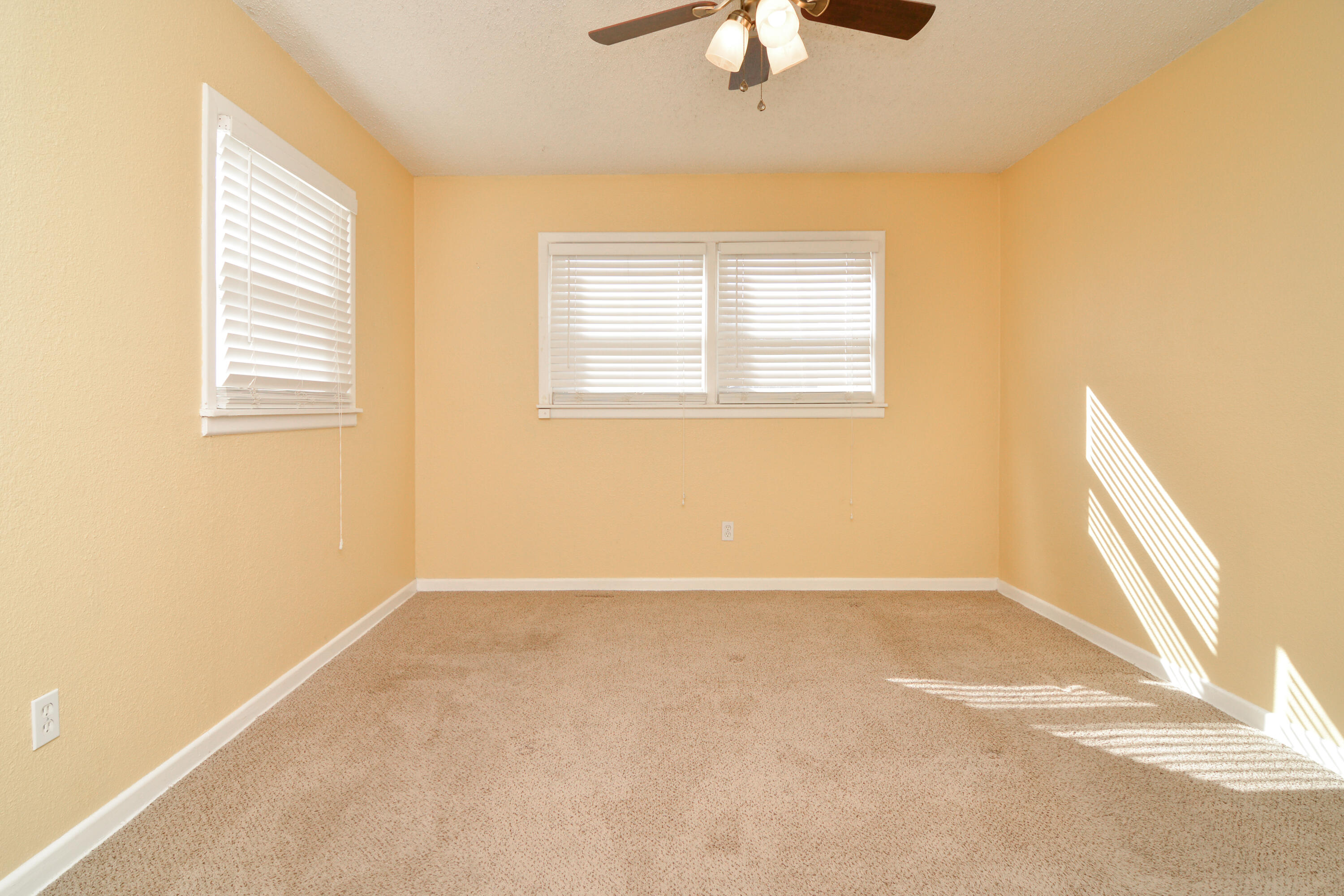 4907 41st Street Lubbock, TX 79414 - Photo 14 of 39 a view of an empty room with a window
