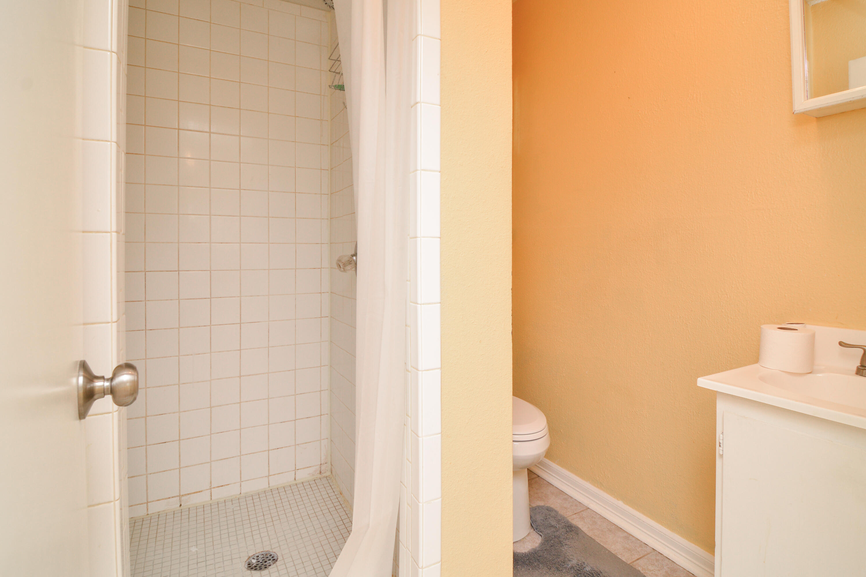 4907 41st Street Lubbock, TX 79414 - Photo 17 of 39 a bathroom with a shower