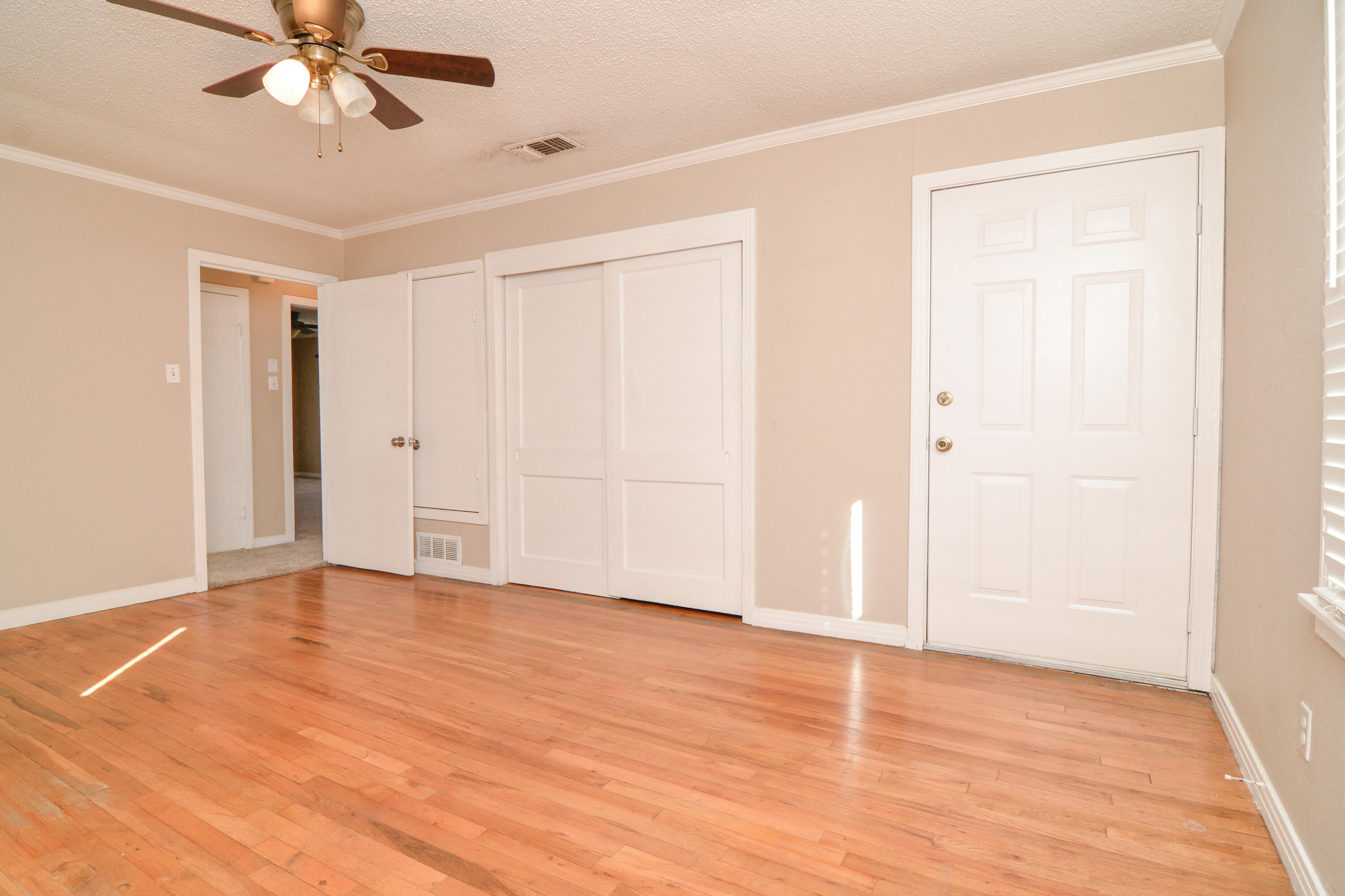 4907 41st Street Lubbock, TX 79414 - Photo 20 of 39 wooden floor in an empty room
