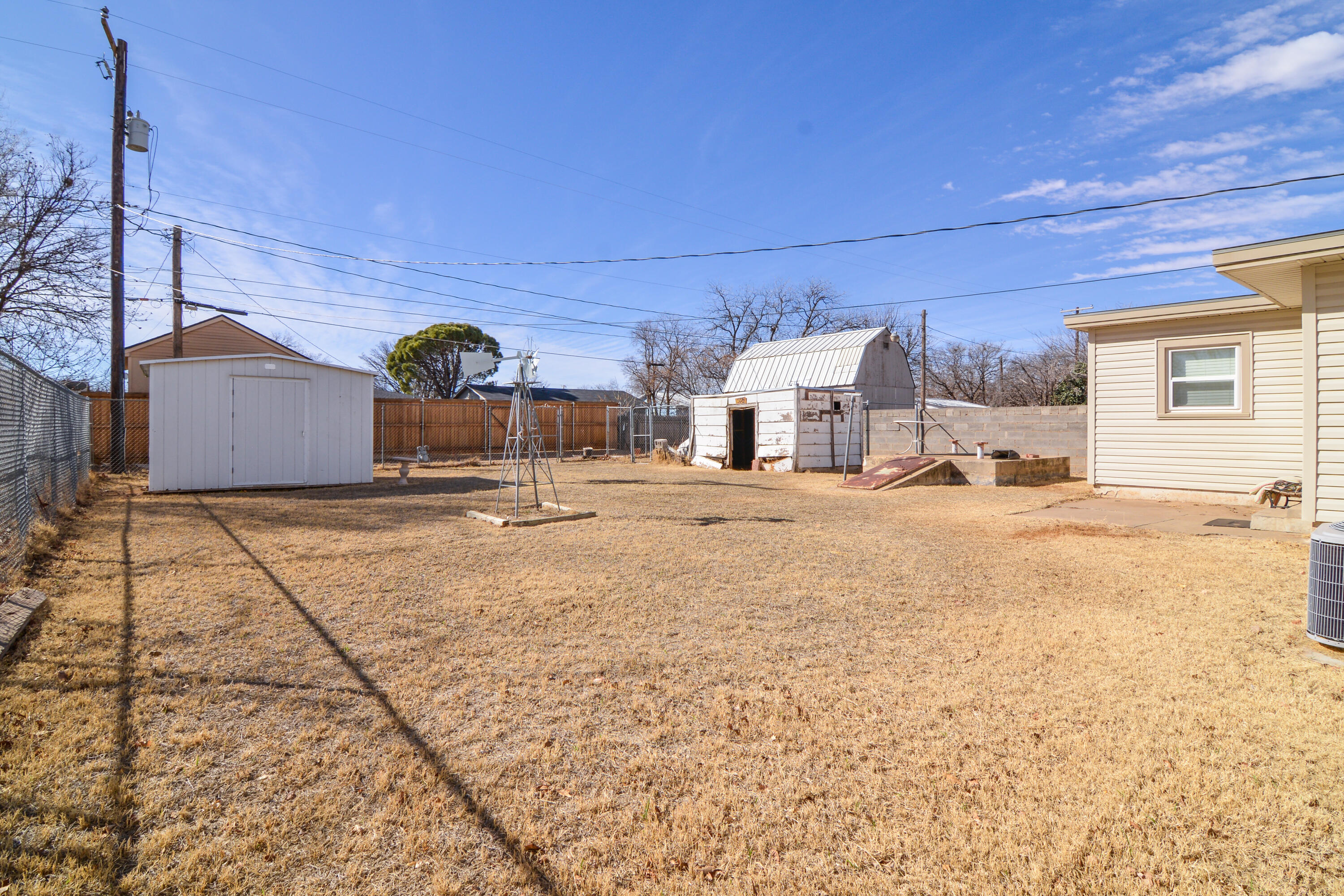 4907 41st Street Lubbock, TX 79414 - Photo 29 of 39 a view of a house with a snow in the background