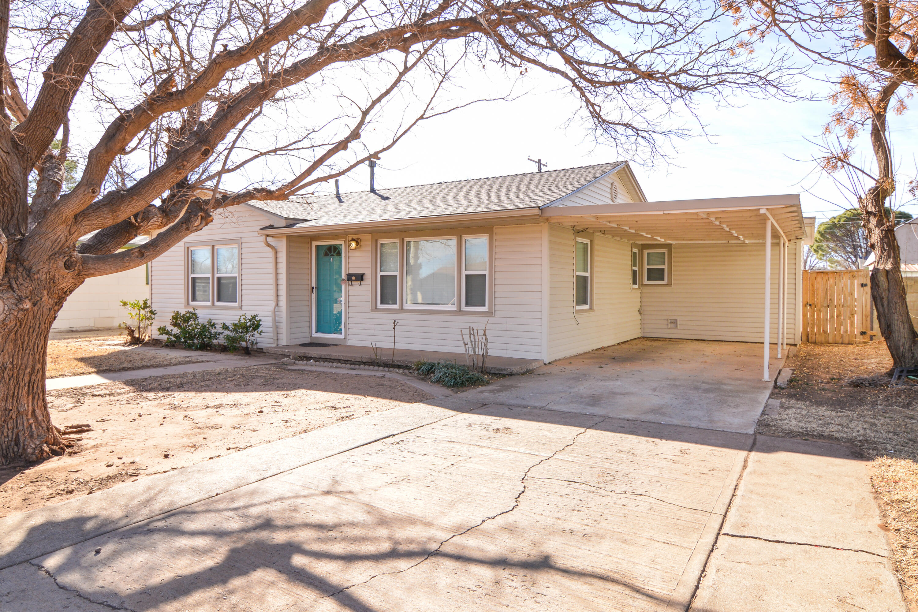 4907 41st Street Lubbock, TX 79414 - Photo 3 of 39 a front view of a house with a yard