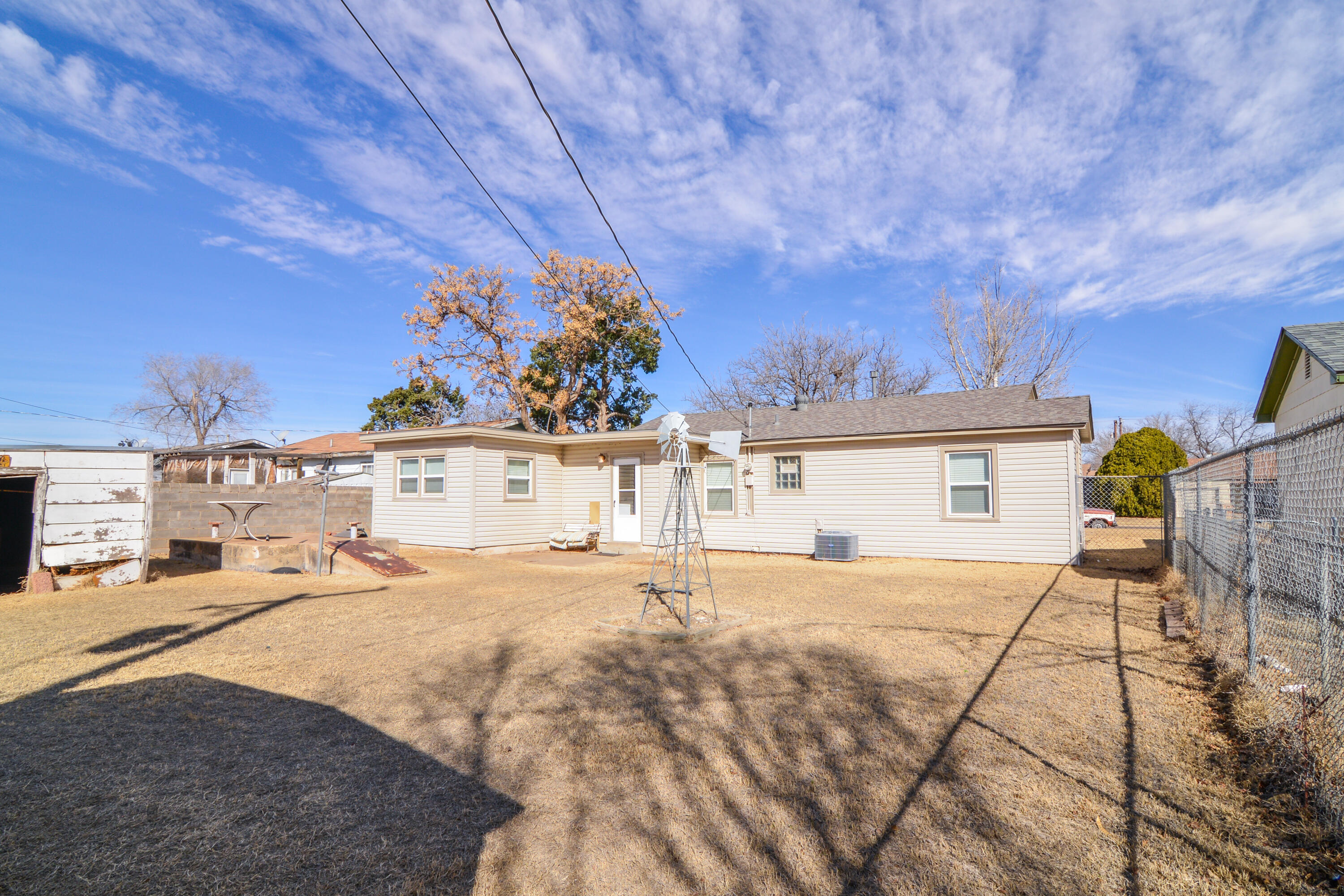 4907 41st Street Lubbock, TX 79414 - Photo 31 of 39 a front view of a house with a yard and garage
