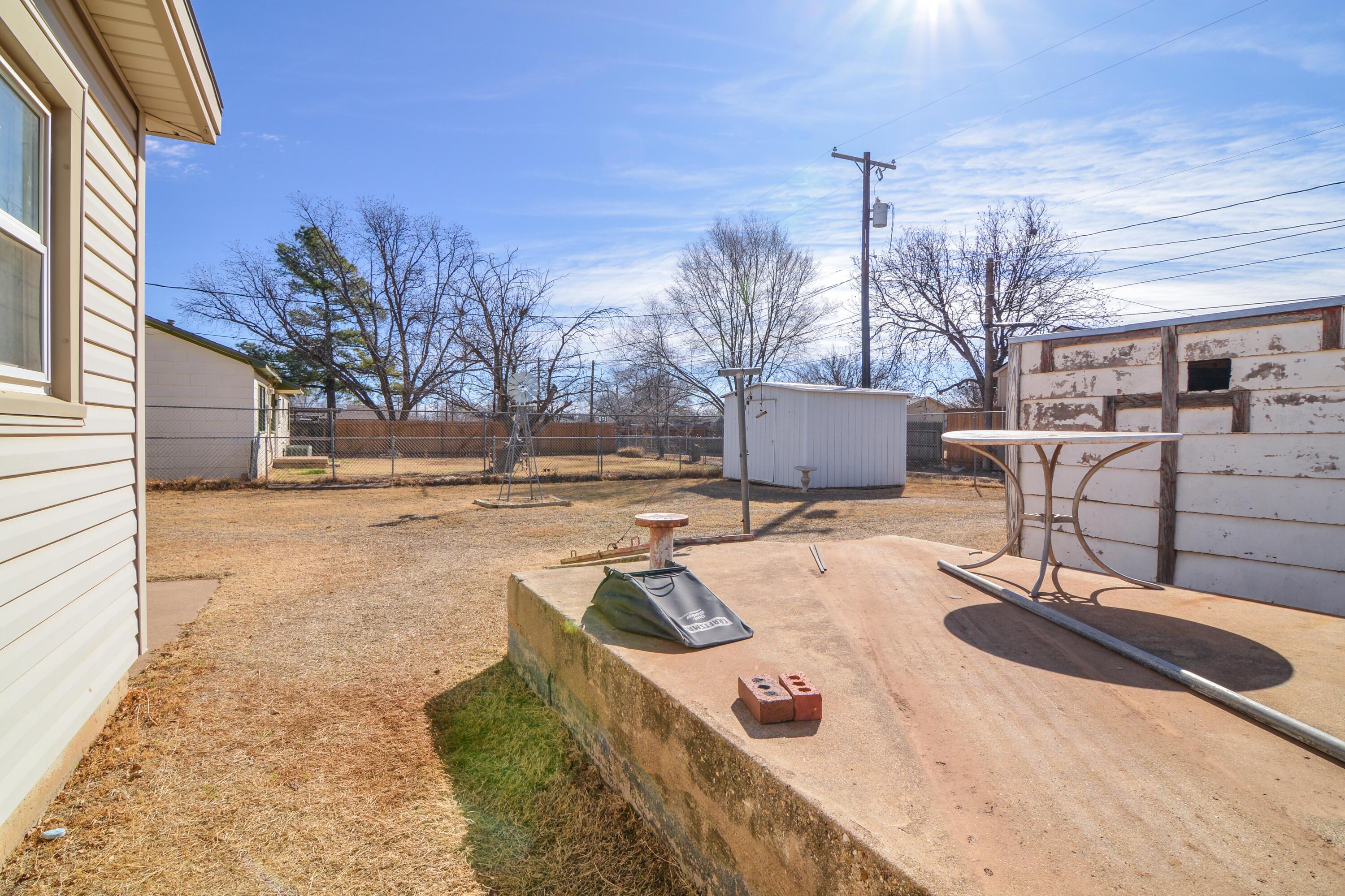 4907 41st Street Lubbock, TX 79414 - Photo 35 of 39 a view of a patio with a yard
