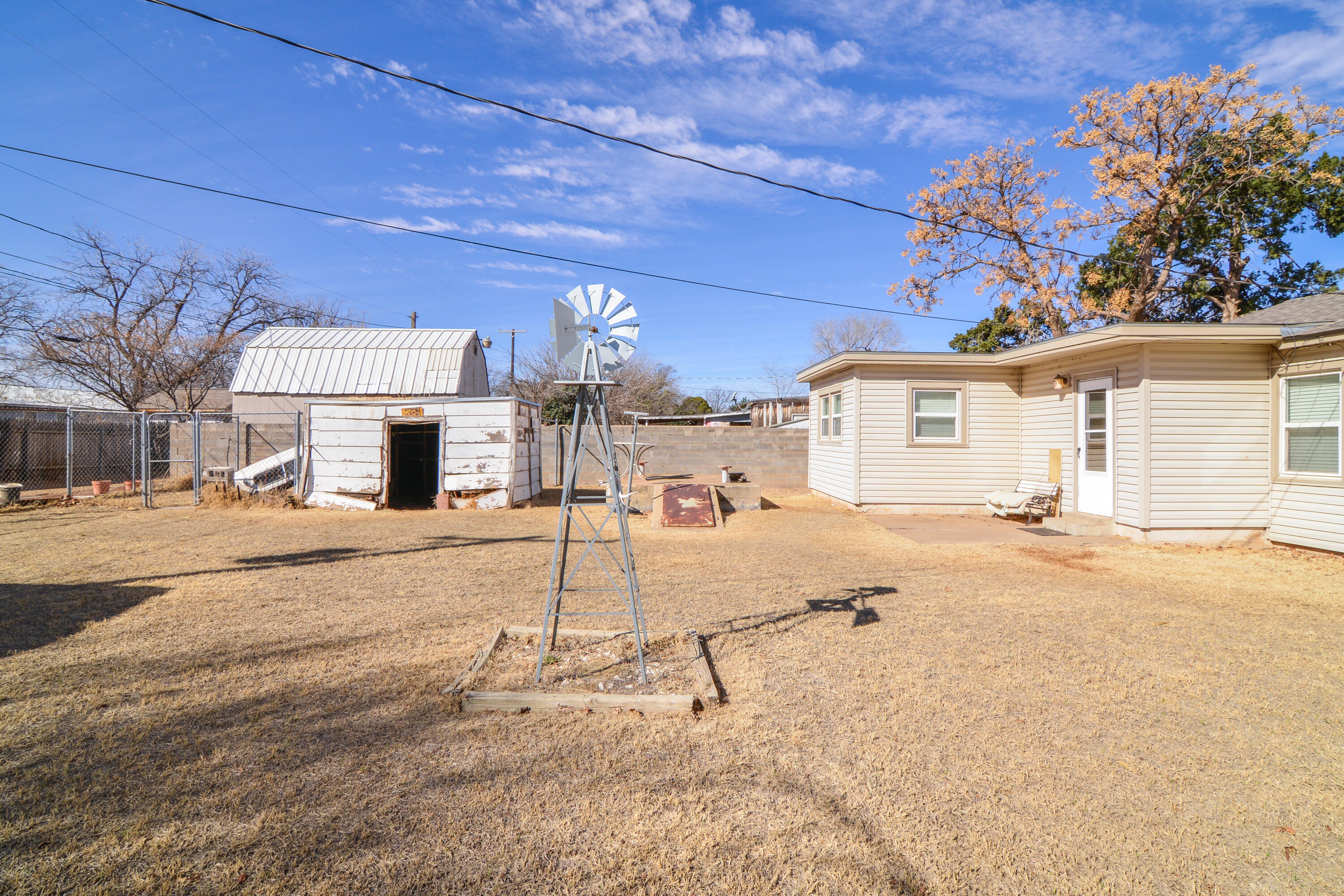 4907 41st Street Lubbock, TX 79414 - Photo 37 of 39 a view of a white house with a patio