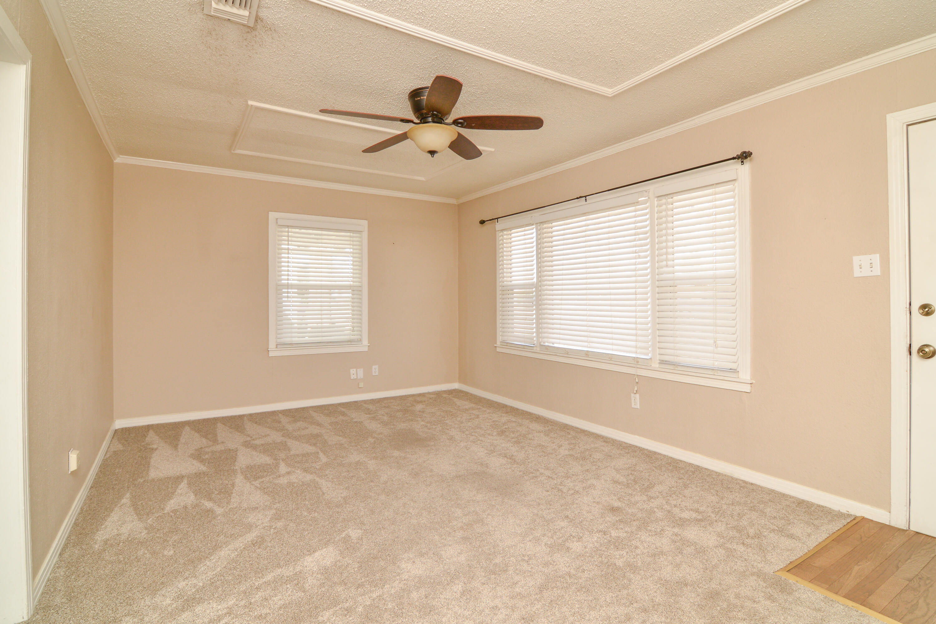 4907 41st Street Lubbock, TX 79414 - Photo 6 of 39 a view of an empty room with a window