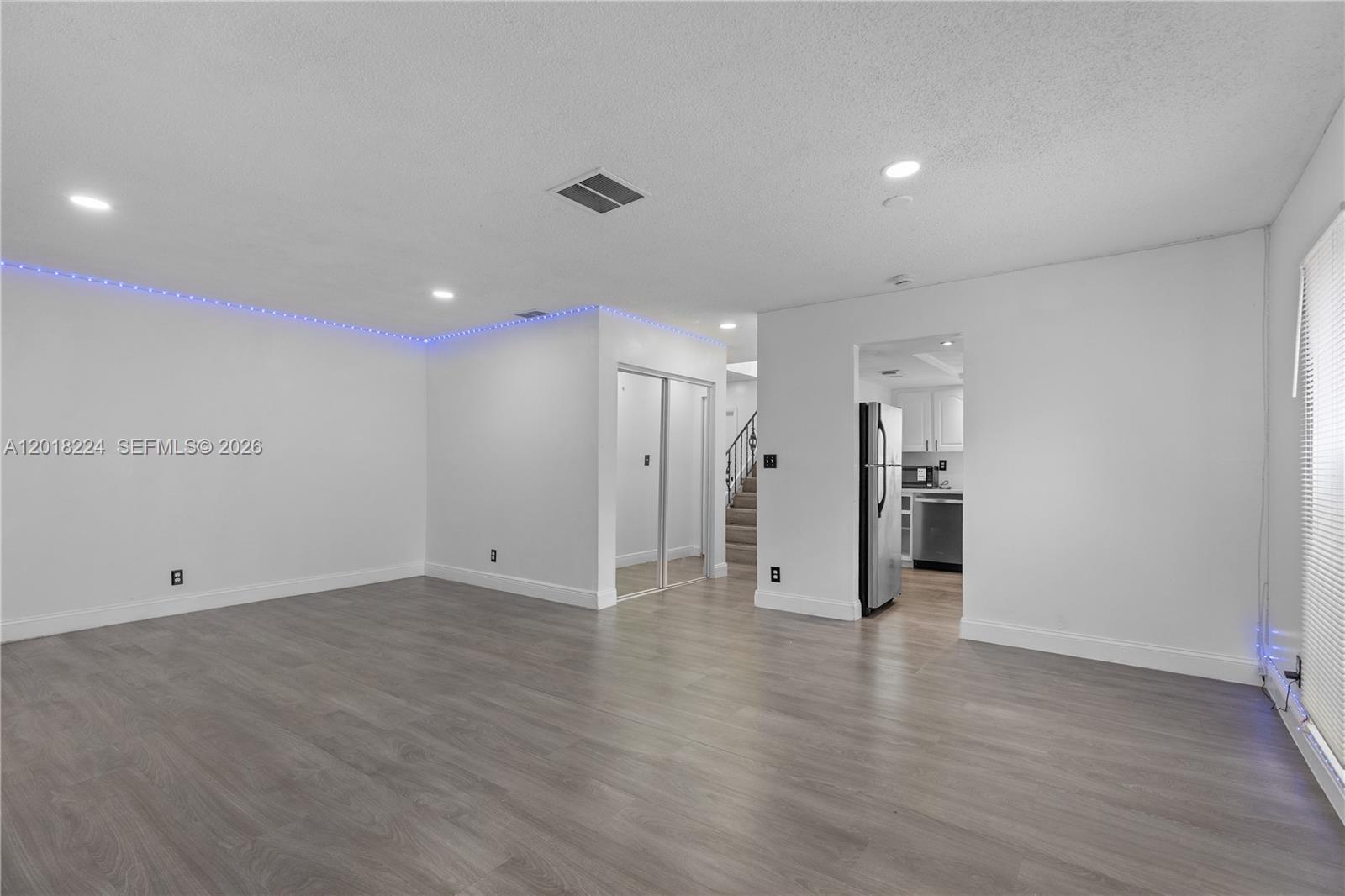 7958 Southwest 6th Street Pompano Beach, FL 33068 - Photo 10 of 57 a view of an empty room with wooden floor