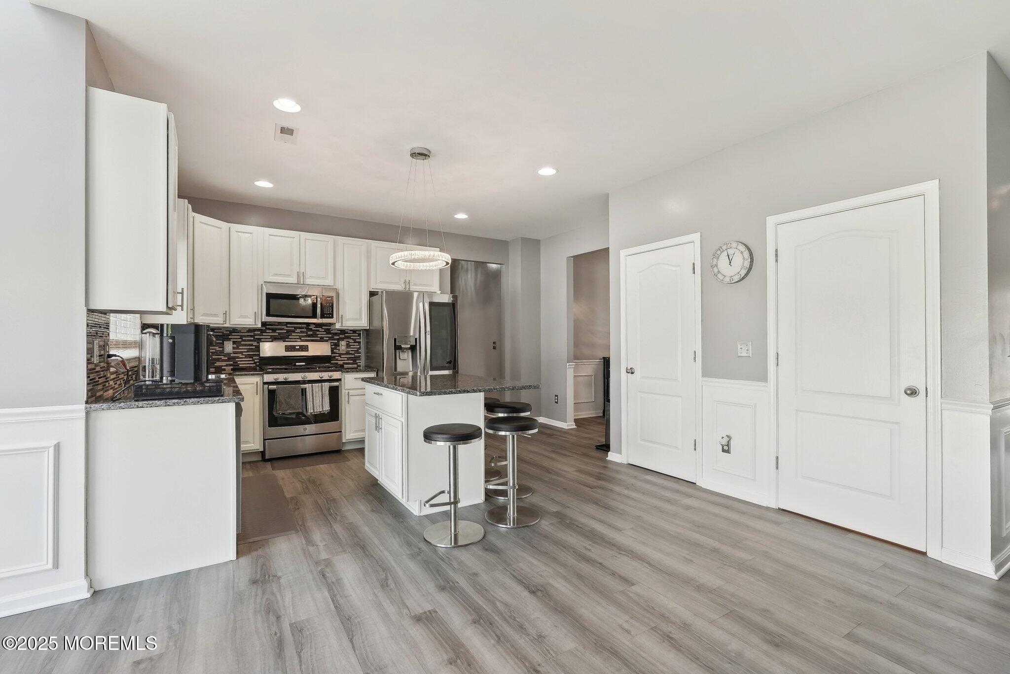 4 Bridle Path Bayville, NJ 08721 - Photo 15 of 44 a kitchen with a refrigerator and white cabinets