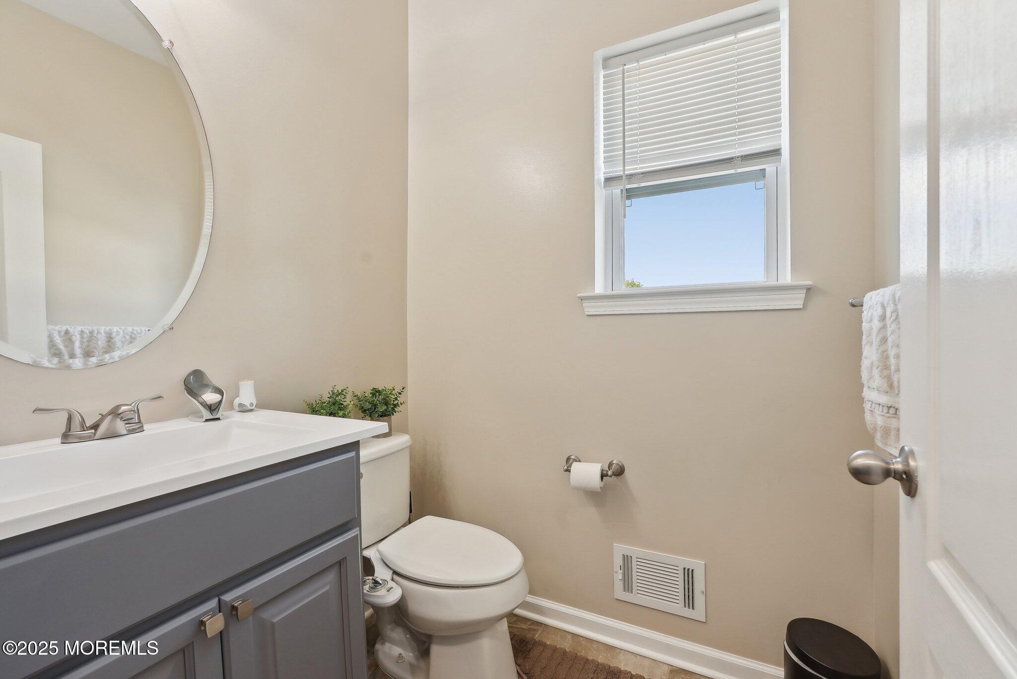 4 Bridle Path Bayville, NJ 08721 - Photo 20 of 44 a bathroom with a sink a toilet and a mirror