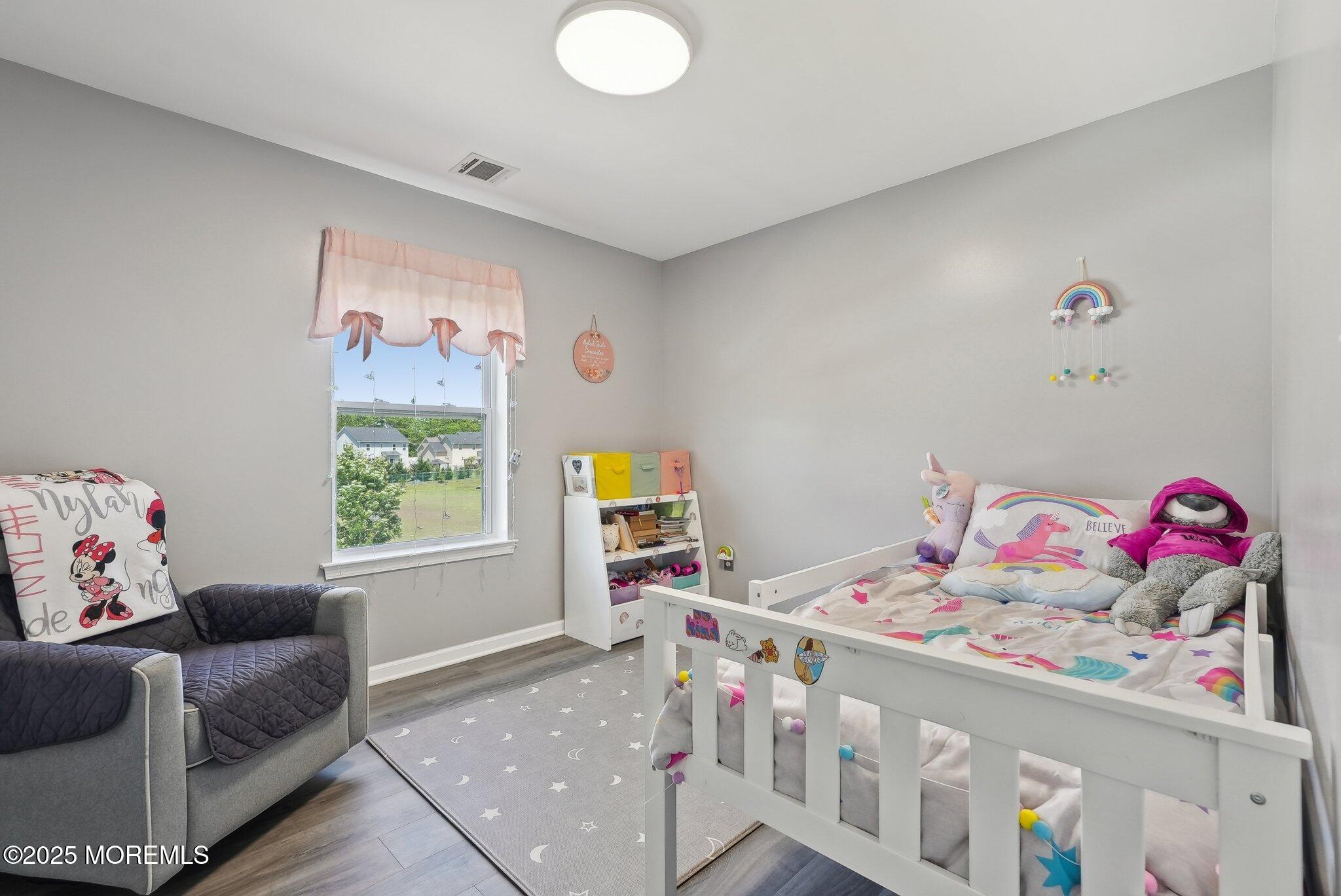 4 Bridle Path Bayville, NJ 08721 - Photo 23 of 44 a bedroom with baby bed and a window
