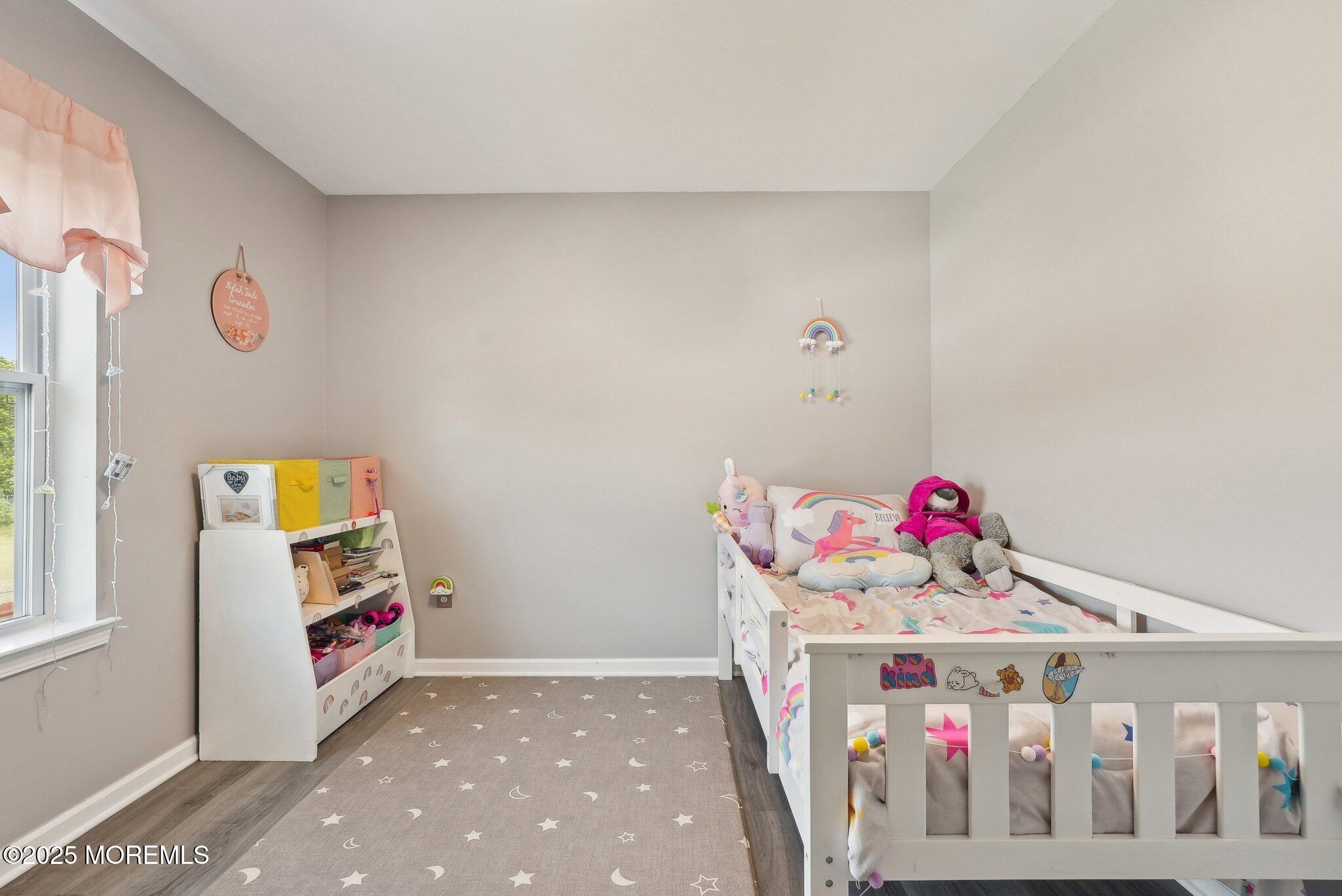 4 Bridle Path Bayville, NJ 08721 - Photo 24 of 44 a view of a livingroom with baby crib